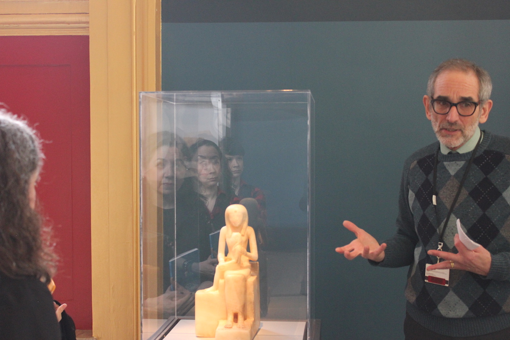 Ed Bleiberg describing one of our signature objects, the Statuette of Queen Ankhnes-meyre II and her Son, Pepy II.