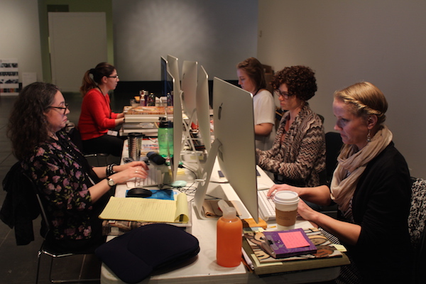 The ASK team fielding questions using our second floor mezzanine as a temporary office space.